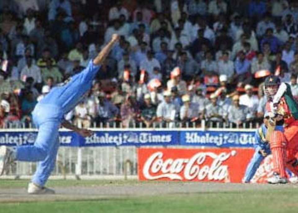 Paul Strang shapes defensively to Zaheer Khan, Coca-Cola Champions Trophy, 2000/01, 5th Match, India v Zimbabwe, Sharjah C.A. Stadium, 26 October 2000.