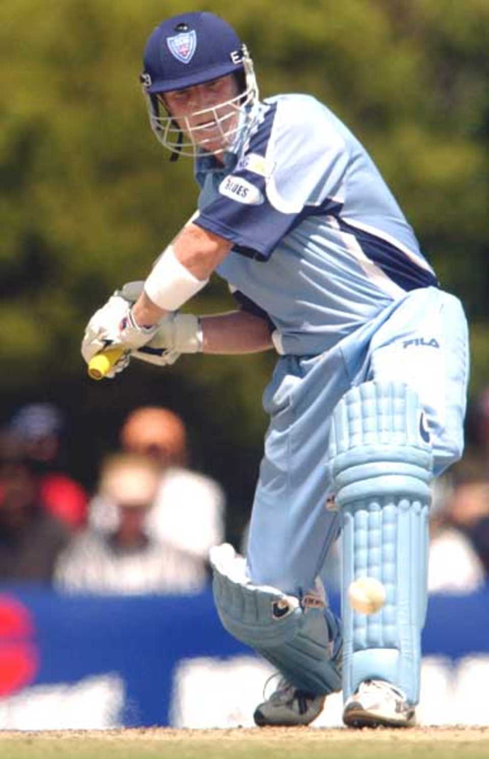 14 Oct 2001: Brad Haddin #24 of the Blues lines up a ball which went for six runs during the ING One Day cricket match between the New South Wales Blues and the Tasmanian Tigers held at Bankstown Oval, Sydney, Australia.