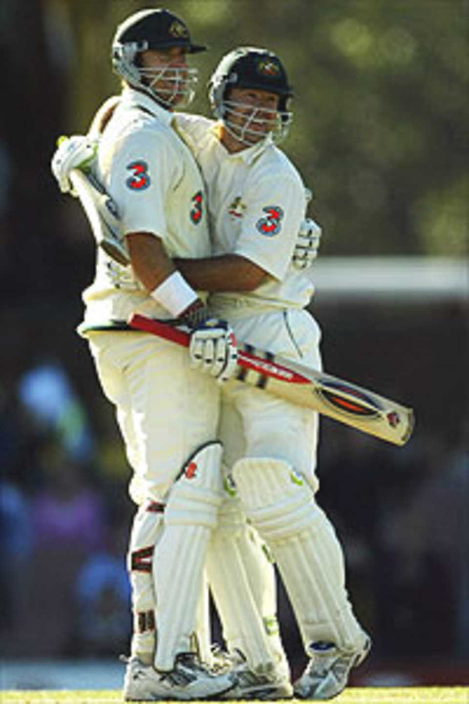 Matthew Hayden of Australia is congratulated by team mate Ricky Ponting on reaching his century and equalsing the score during day four of the second Test between Australia and Zimbabwe played at the SCG on October 20, 2003 in Sydney, Australia.