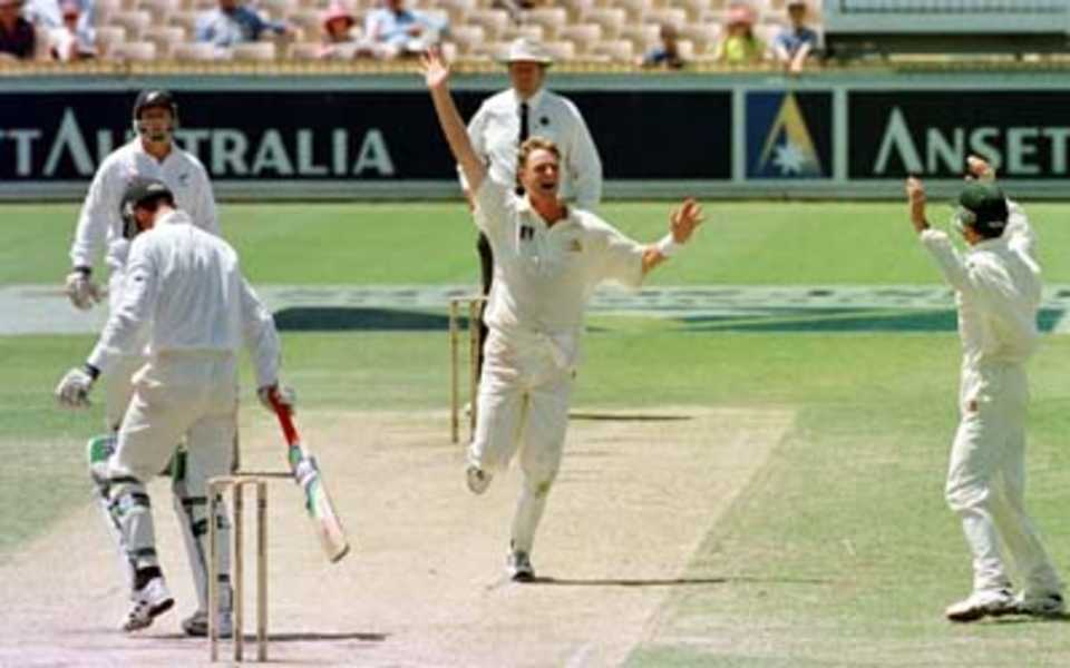 Simon Cook celebrates his fifth wicket on debut as Shayne O'Connor walks, caught Taylor... Australia v New Zealand 2nd Test, Day Four, at the WACA, Perth, Thursday November 23rd 1997