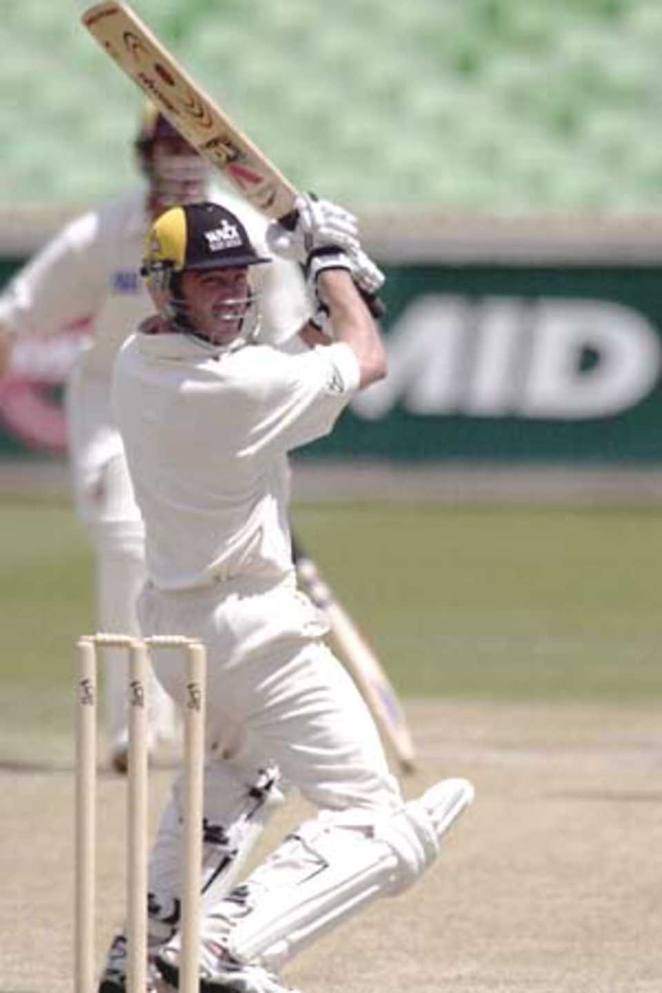 12 Nov 2000: Damien Martyn for Western Australia hits the winning runs in the match between the Western Warriors and the West Indies at the WACA ground in Perth, Australia.
