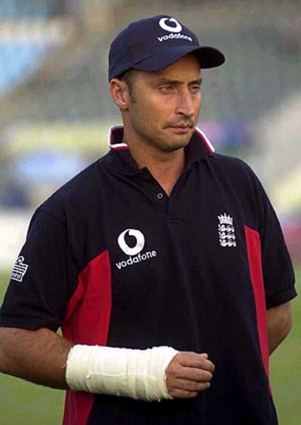 19 Nov 2000: Nasser Hussain the England captain looks on with his hand in a bandage after the 1st Pakistan v England Test Match at the Gadaffi Stadium, Lahore, Pakistan.