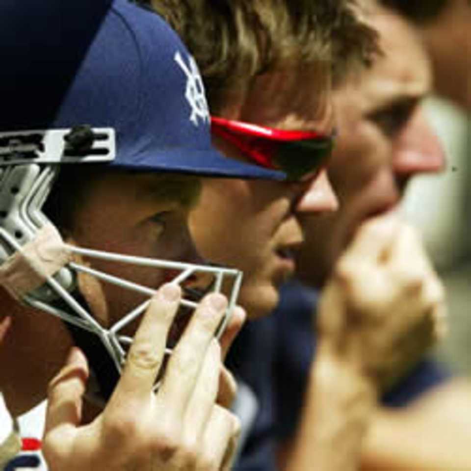 MELBOURNE - NOVEMBER 11: Victorian Players look on anxiously as play begins with Victoria needing just 26 runs to defeat Queensland during the final day of the Pura Cup match played at the MCG in Melbourne, Australia on November 11, 2002.