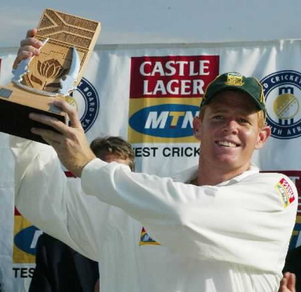 Shaun Pollock holds the Castle Lager/MTN trophy after 2-0 win