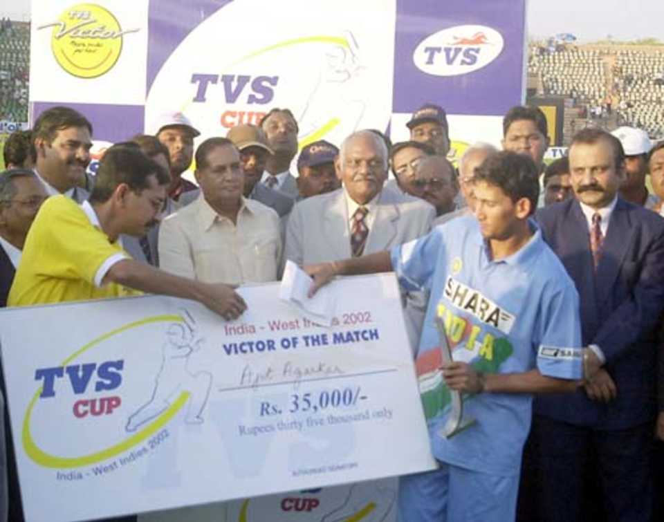 Ajit Agarkar receives the Man of the Match award for his bowling efforts