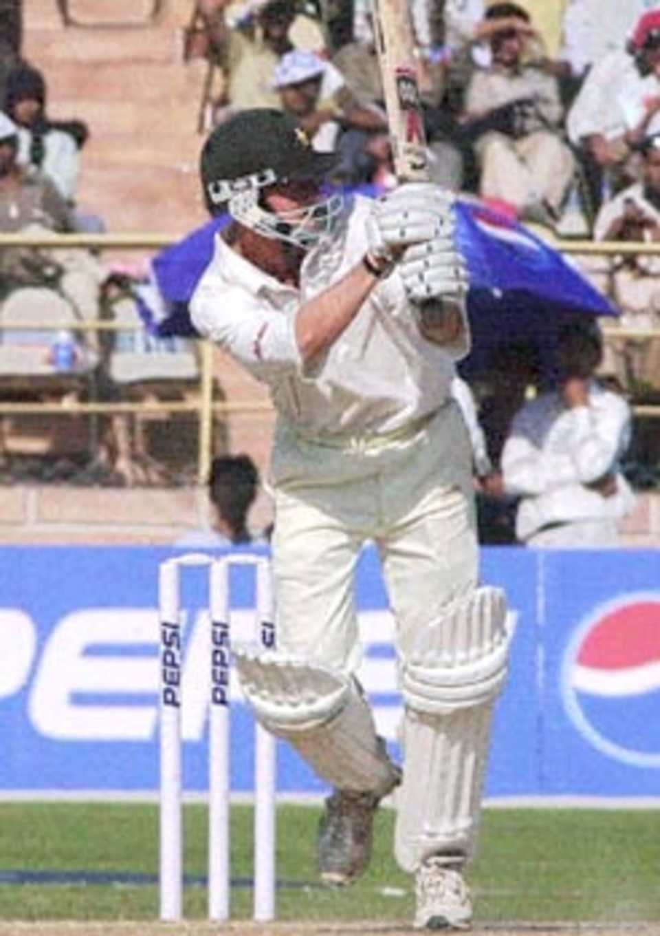 Zimbabwe batsman Grant Flower hits a ball to boundary during the third one-day cricket match in Jodhpur 08 December 2000. Flower scored 70 runs. Zimbabwe won the match by one wicket off the penultimate ball to record their fist win in the five-match series.