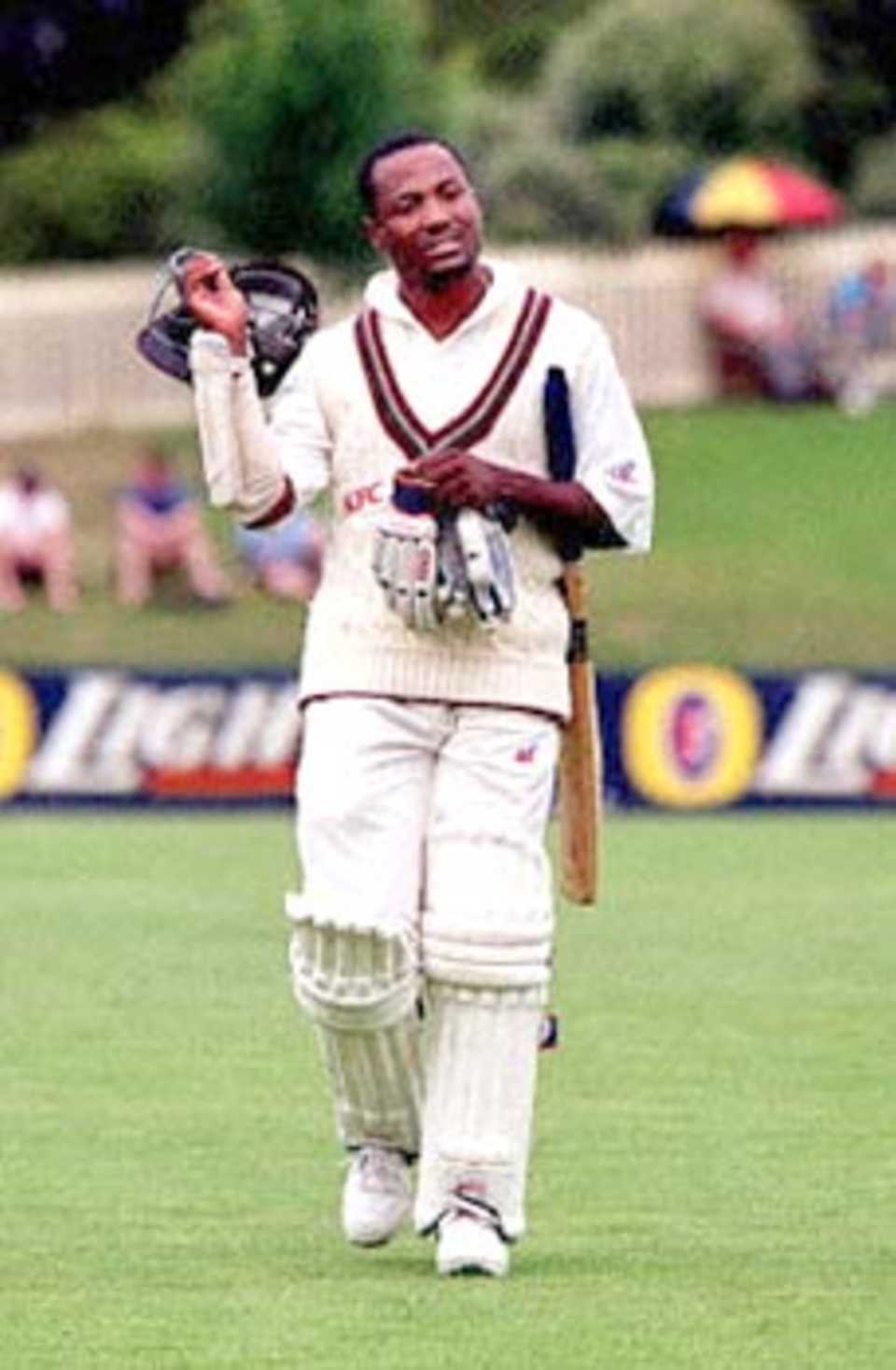West Indian batman Brian Lara takes his helmet off 11 December 2000, during a match against Australia on the third day of the West Indies Cricket Tour at Bellerive Oval, Hobart. Lara has been nursing a hamstring injury that is defying specialists' prediction of an early cure.