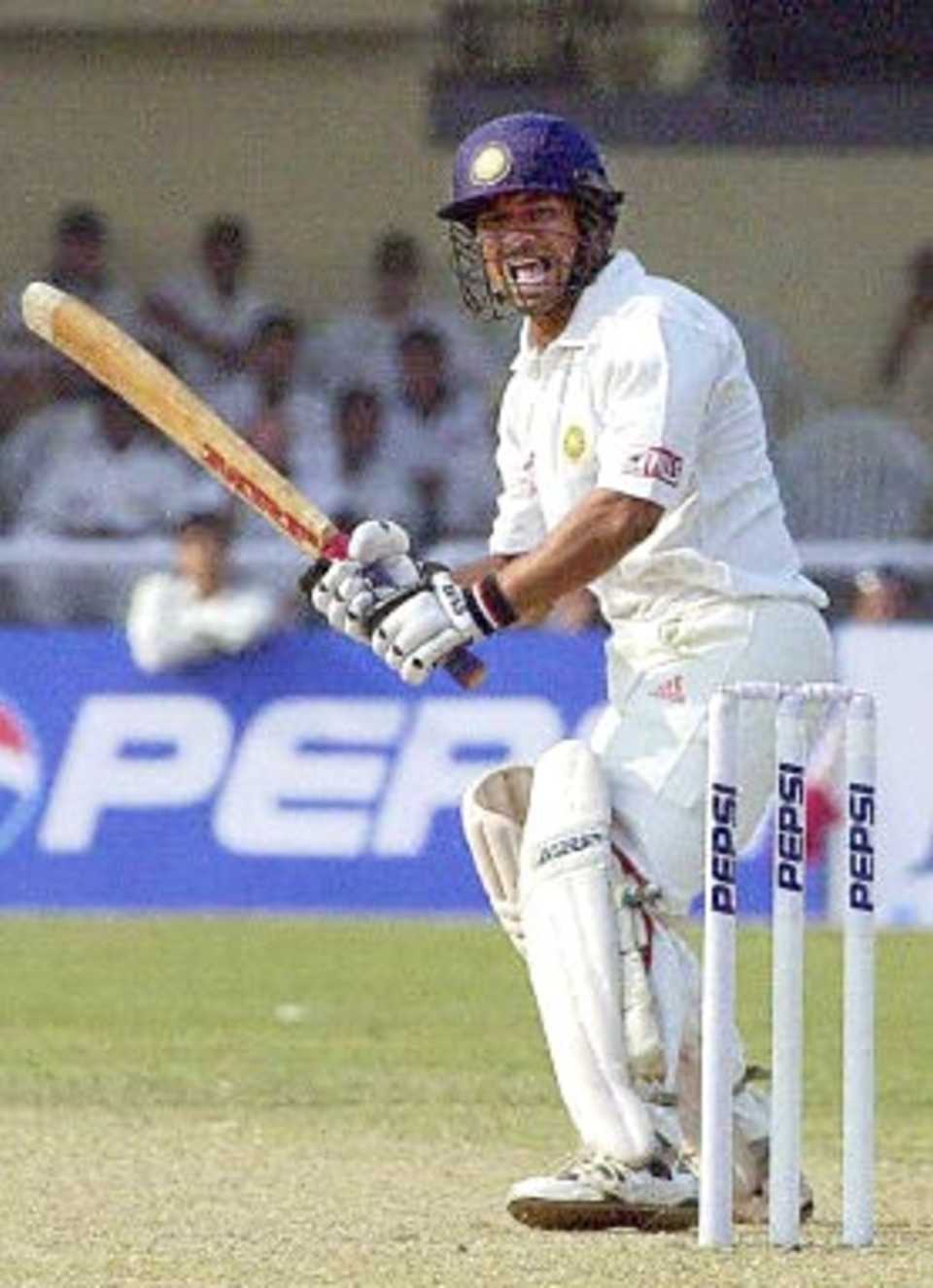 Indian star batsman Sachin Tendulkar shouts after hitting a boundary off Zimbabwean bowler Travis Friend during the fourth one-day international cricket match in Kanpur, 11 December 2000. Tendulkar scored 62 runs. India won the match by nine wickets to take the series 3-1.