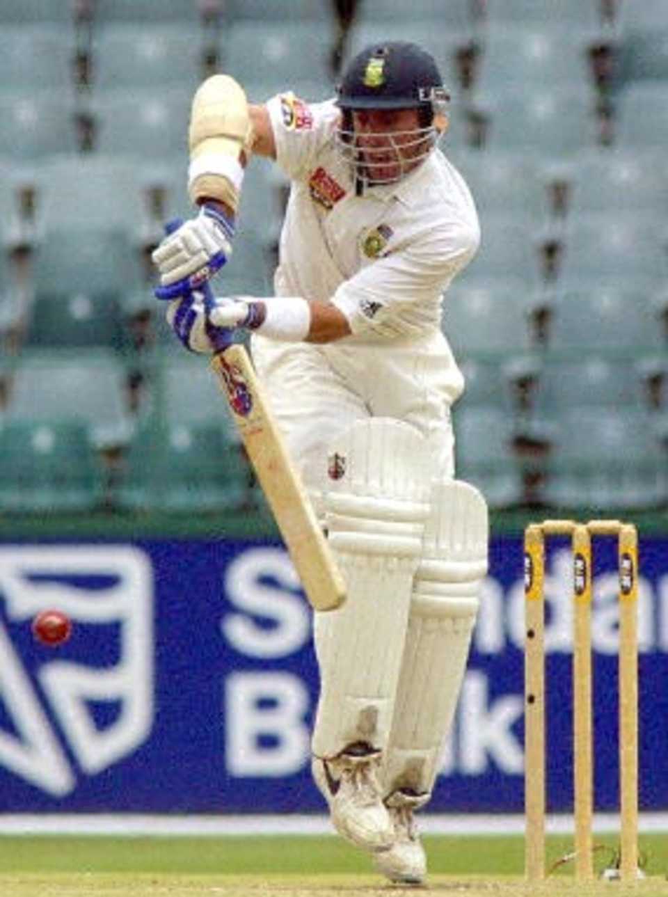 South African batsman Nicky Boje stops a fast ball 12 December 2000 during the 5th and final day of the third and final five day cricket Test between New Zealand and South Africa , at the Wanderers cricket ground in Johannesburg.