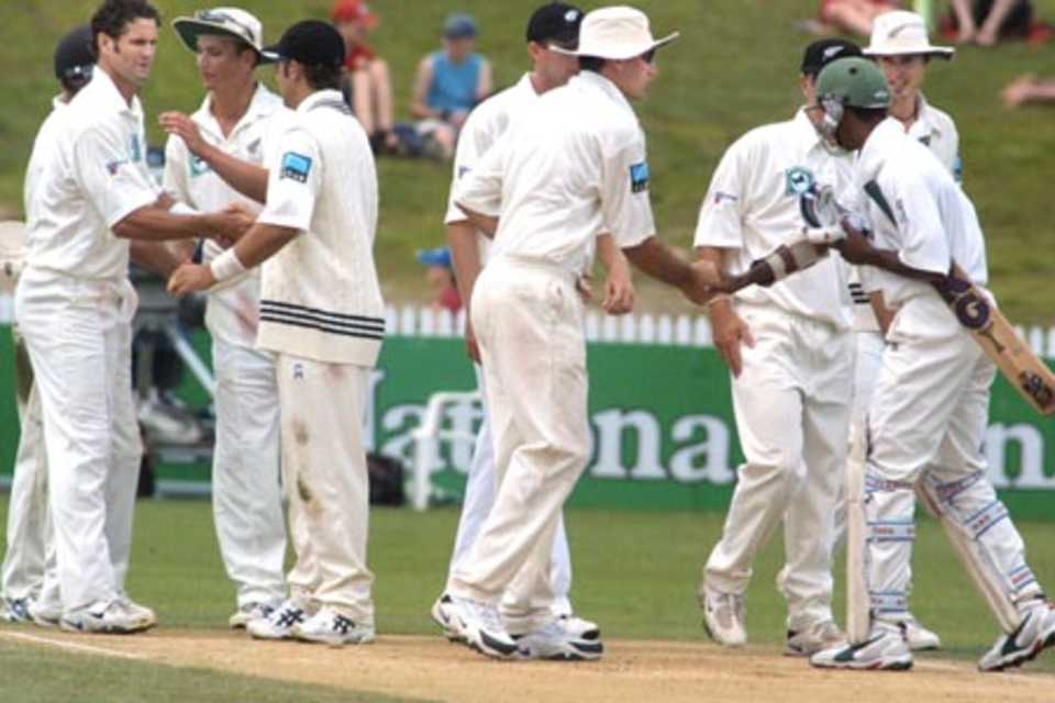 Players shake hands at the end of the match. From left, Mohammad Sharif (obscured), Chris Cairns, Shane Bond, Craig McMillan, Chris Drum (obscured), Stephen Fleming, Mathew Sinclair (obscured), Manjural Islam, Chris Martin. 1st Test: New Zealand v Bangladesh at WestpacTrust Park, Hamilton, 18-22 Dec 2001 (22 December 2001).