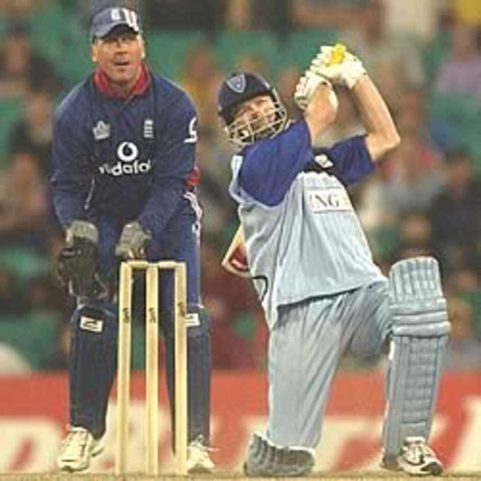 SYDNEY - DECEMBER 6: Steve Waugh of NSW hits one of his three sixes to finish the game during the New South Wales Blues v England one day warm up match at the Sydney Cricket Ground in Sydney, Australia on December 6, 2002.