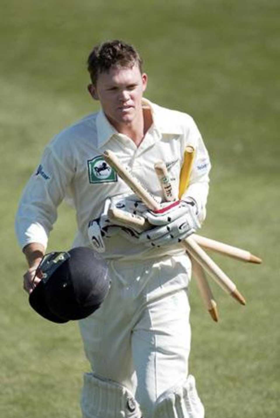 Vincent runs from the field with a clutch of stumps after New Zealand won the match. 1st Test: New Zealand v India at Wellington, 12-16 Dec 2002