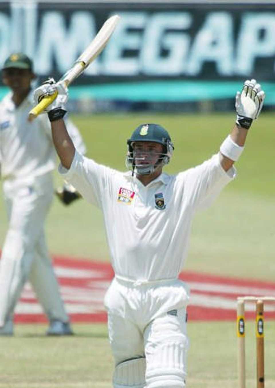 Herschelle Gibbs celebrates scoring the winning runs in Durban, he and Graeme Smith scored the 44 needed to achieve a 10-wicket win over Pakistan in the first Test match, Sun 29 Dec 2002