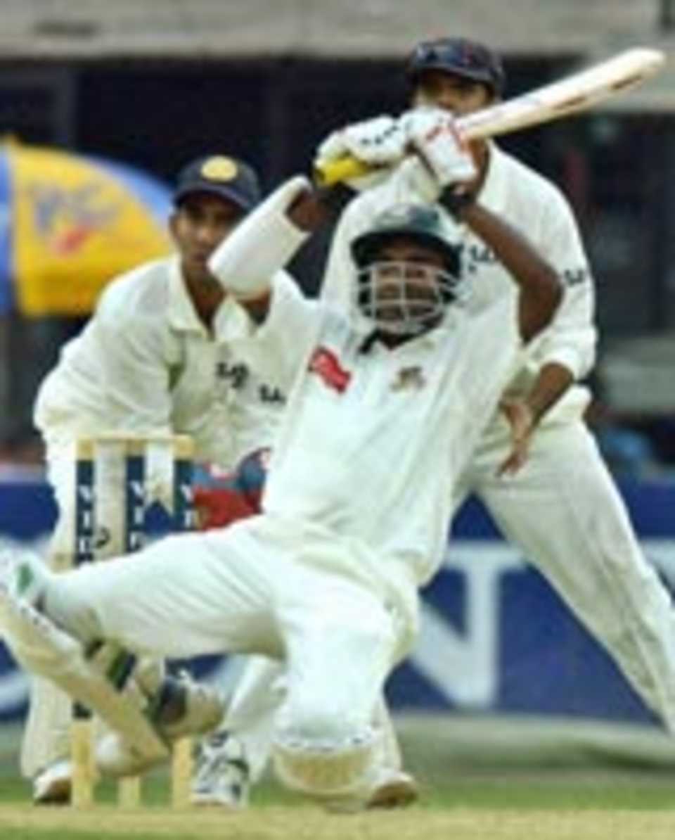 Manjural Islam Rana plays a peculiar stroke on bended knees, Bangladesh v India, Dhaka, December 13, 2004