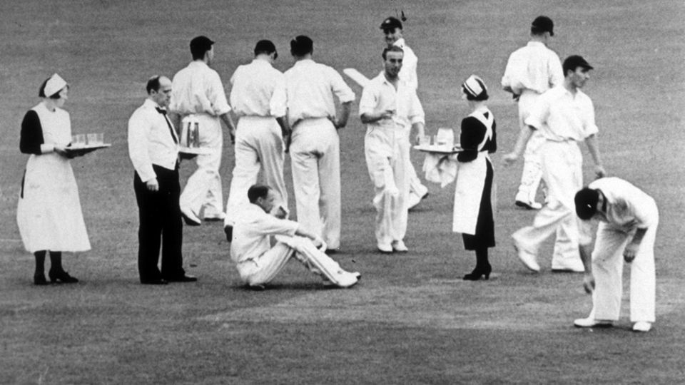 Old style: players are served tea on the field at Headingley, 1938