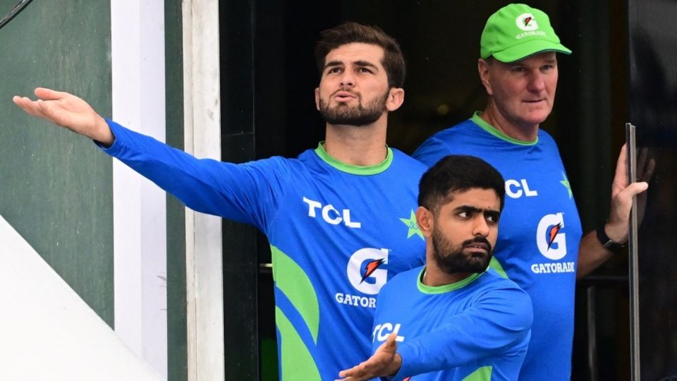 Shaheen Shah Afridi, Babar Azam and Grant Bradburn check if the rain has stopped
