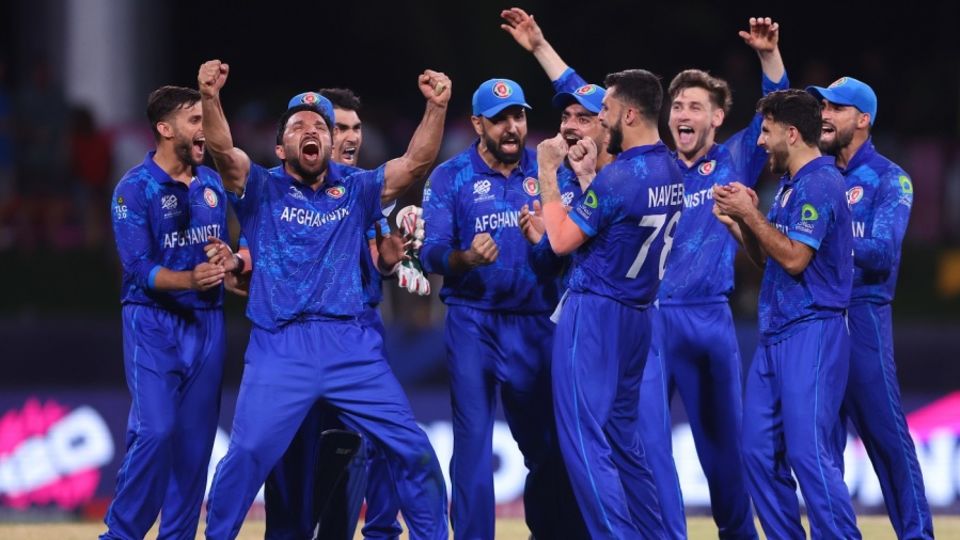 Gulbadin Naib and his team-mates celebrate a review going their way, Afghanistan vs Australia, T20 World Cup, Super Eight, Group 1, Kingstown, June 22, 2024
