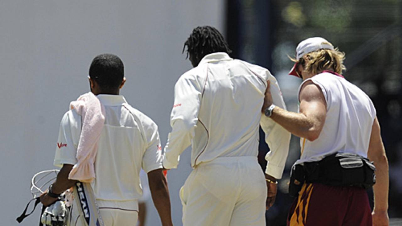 Chris Gayle is helped from the field by the West Indies physio, CJ Clark, West Indies v England, 5th Test, Trinidad, March 8, 2009
