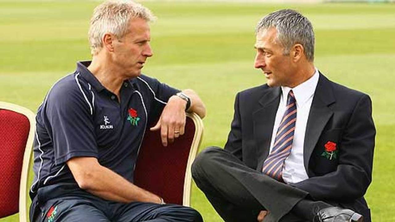 Peter Moores and Mike Watkinson in discussion at Old Trafford, Manchester, April 6, 2009
