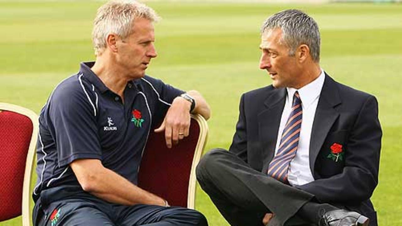 Peter Moores and Mike Watkinson in discussion at Old Trafford, Manchester, April 6, 2009