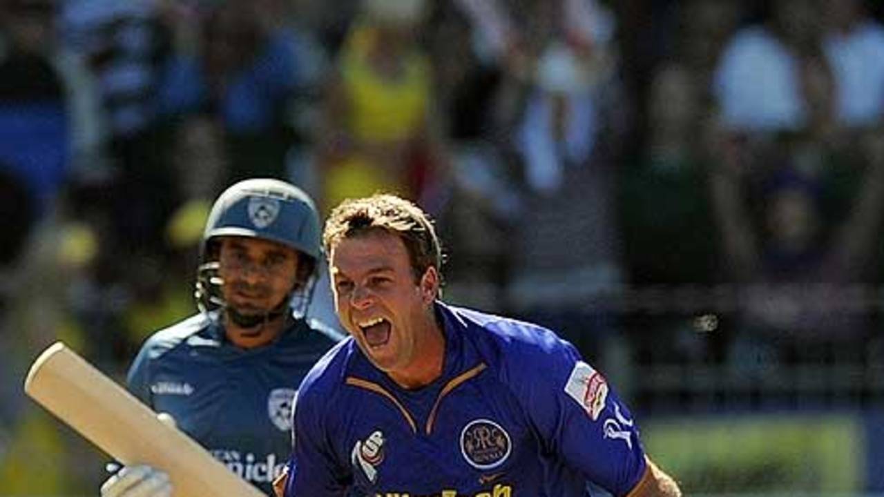 Shane Harwood celebrates a wicket with his first ball in the IPL