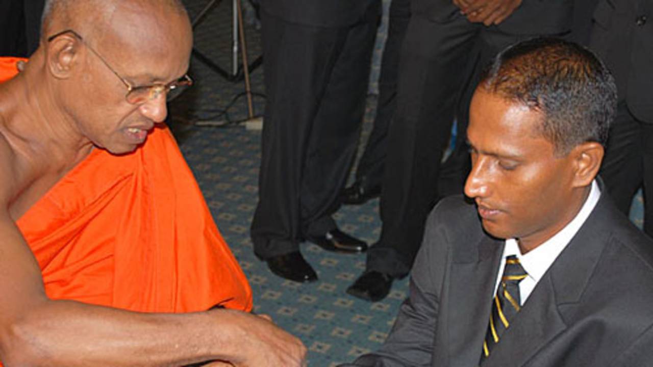 Indika de Saram gets the blessings of a monk, Colombo, May 28, 2009