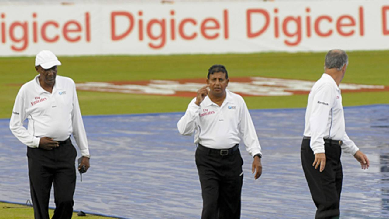 The umpires do a recce of the playing conditions, West Indies v Bangladesh, 2nd Test, Grenada, 4th day, July 20, 2009 