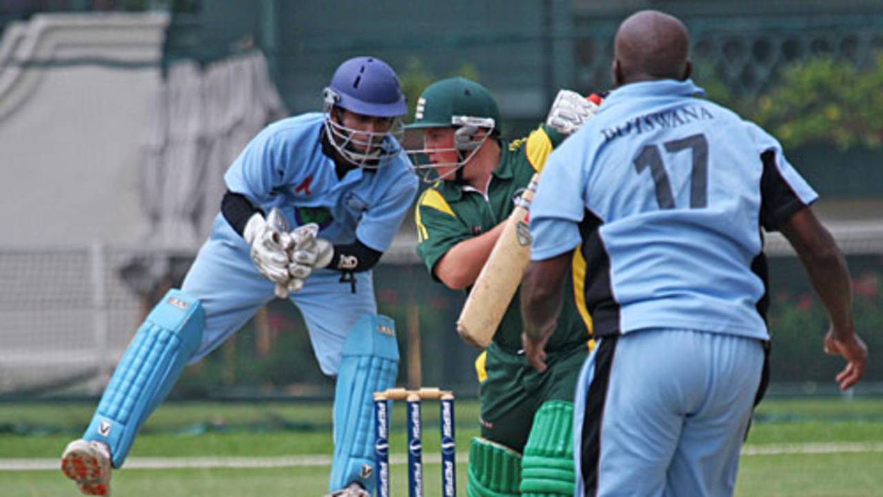 Wicketkeeper Denzil Sequeira takes a tough catch
