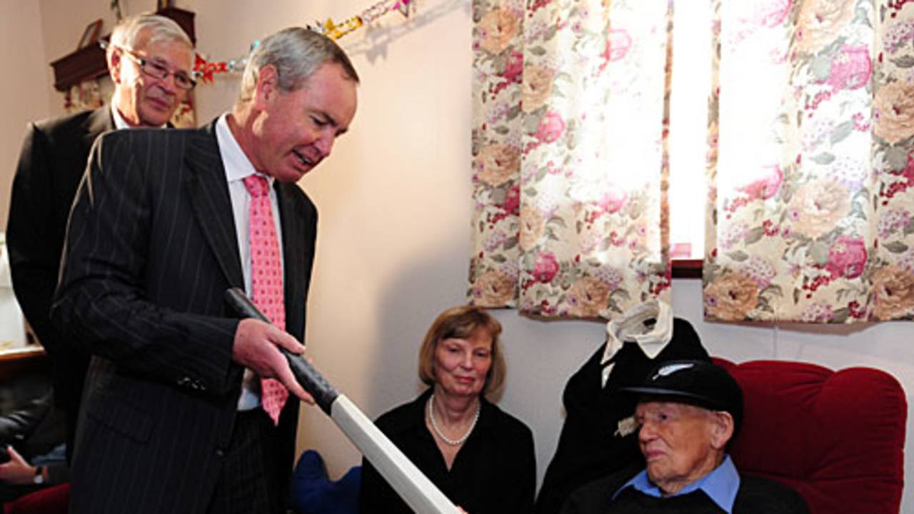 Eric Tindill, the oldest Test cricketer, is presented a signed bat by the New Zealand Cricket chairman Alan Isaac on his 99th birthday, Wellington, December 18, 2009