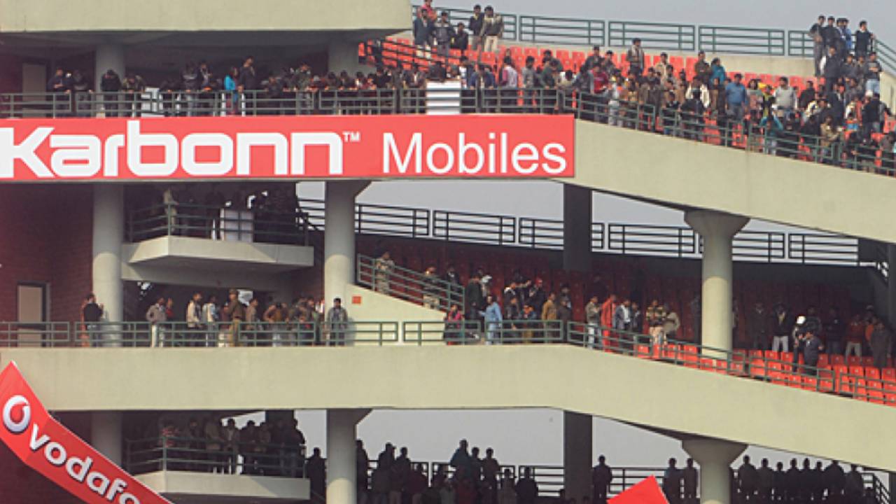 Irate fans tear down advertising banners at the Feroz Shah Kotla after the match was abandoned, India v Sri Lanka, 5th ODI, December 27, 2009