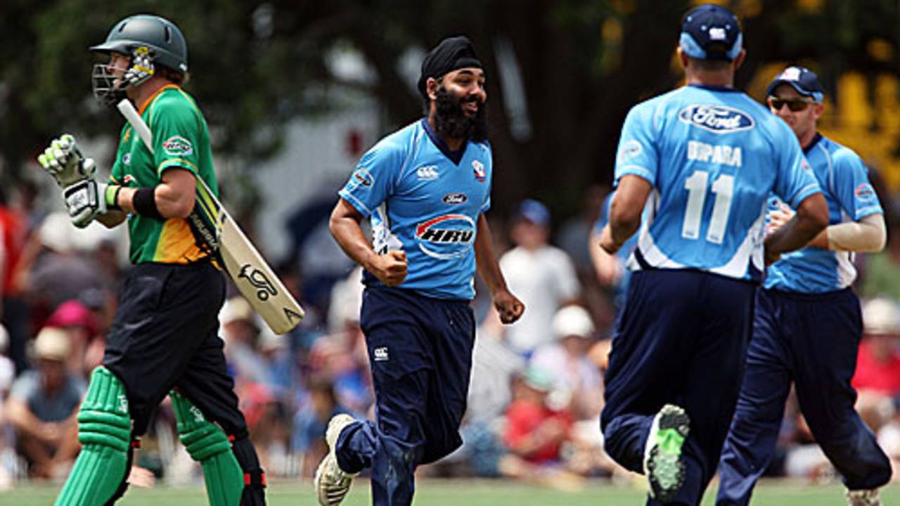 Bhupinder Singh celebrates the run out of Timothy Weston
