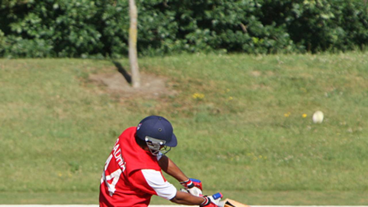 Ashish Gadhia lofts the ball down the ground against Canada U19