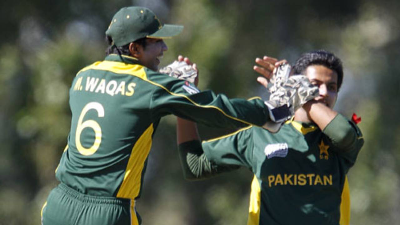 Mohammad Waqas celebrates with Sarmad Bhatti after he dismissed Tom Beaton