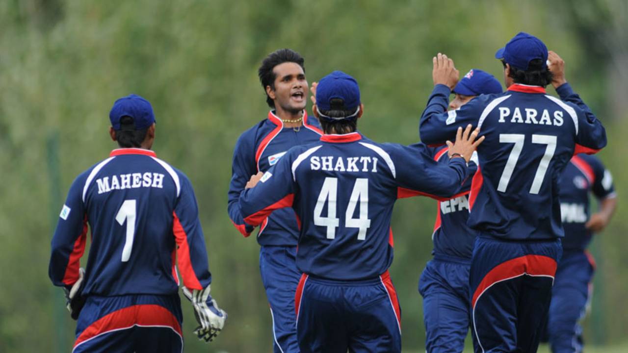 Nepal bowler Binod Das celebrates a dismissal with his team-mates