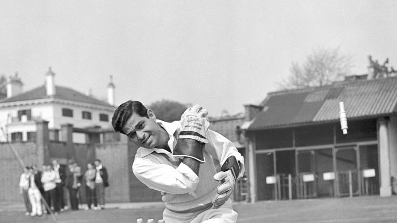 Indian wicketkeeper Naren Tamhane poses behind the stumps, April 21, 1959