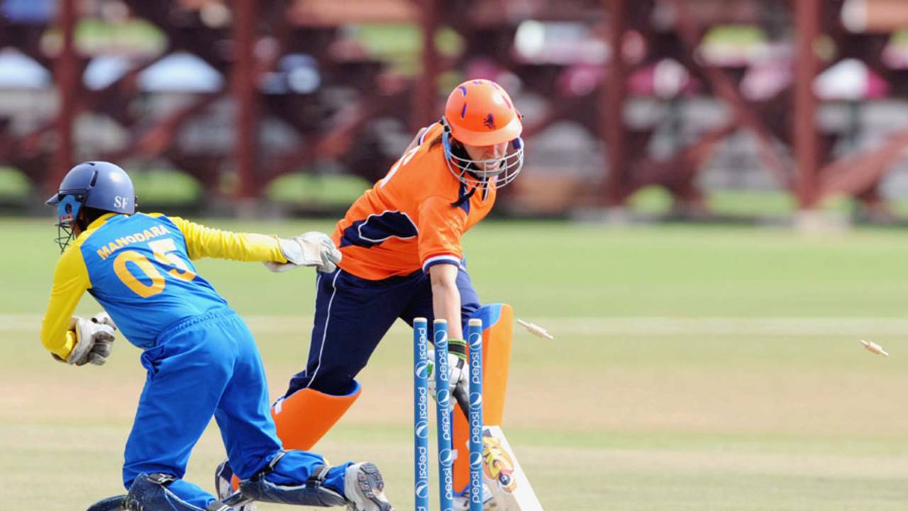 Netherlands opener Esther Lanser is run out by Dilani Manodara