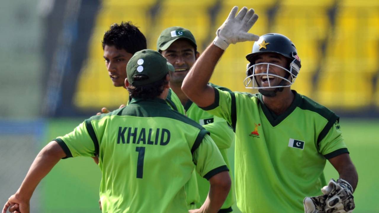 Wicketkeeper Sheharyar Ghani and Khalid Latif are delighted after a Sri Lanka run-out