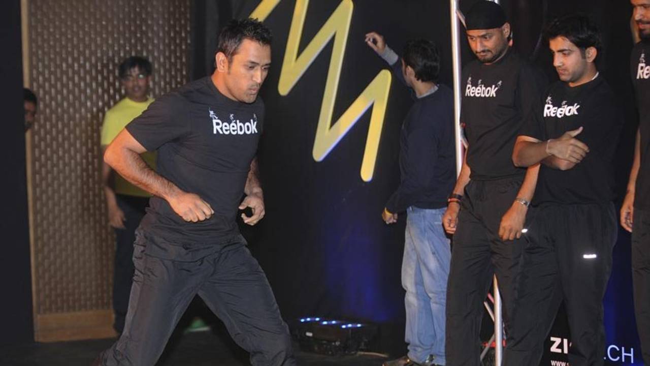 MS Dhoni performs an exercise at a promotional event, New Delhi, February 2, 2011