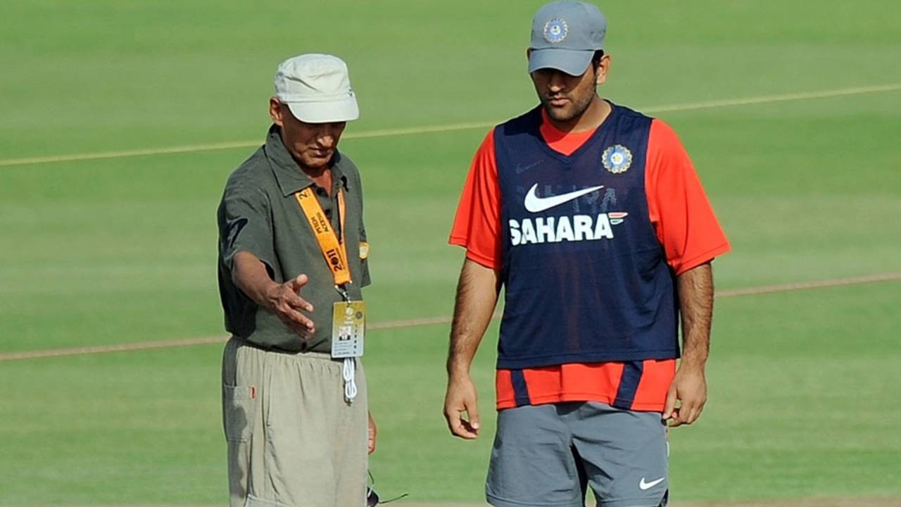 MS Dhoni and curator Daljit Singh inspect the Mohali pitch, Mohali, March 27, 2010