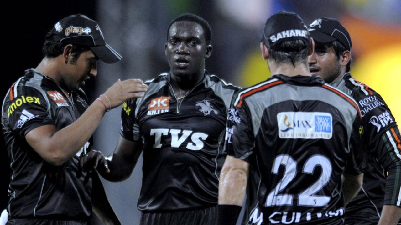 Jerome Taylor is congratulated after getting Michael Hussey