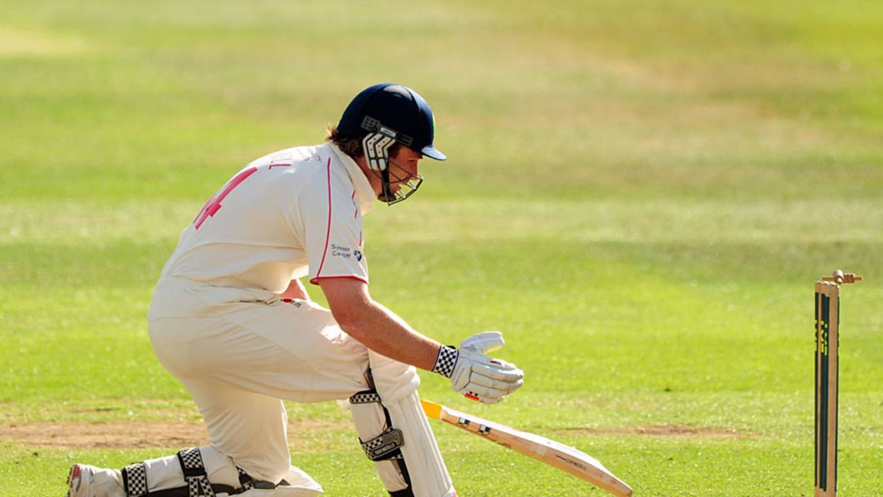 Michael Powell can't stop the ball rolling back into his stumps on 99
