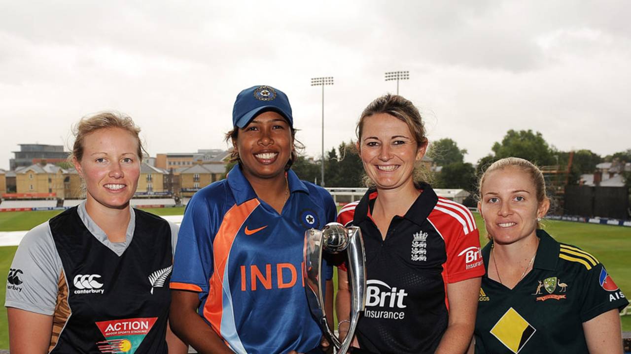 Aimee Watkins, Jhulam Goswami, Charlotte Edwards and Jodie Fields pose with the trophy 