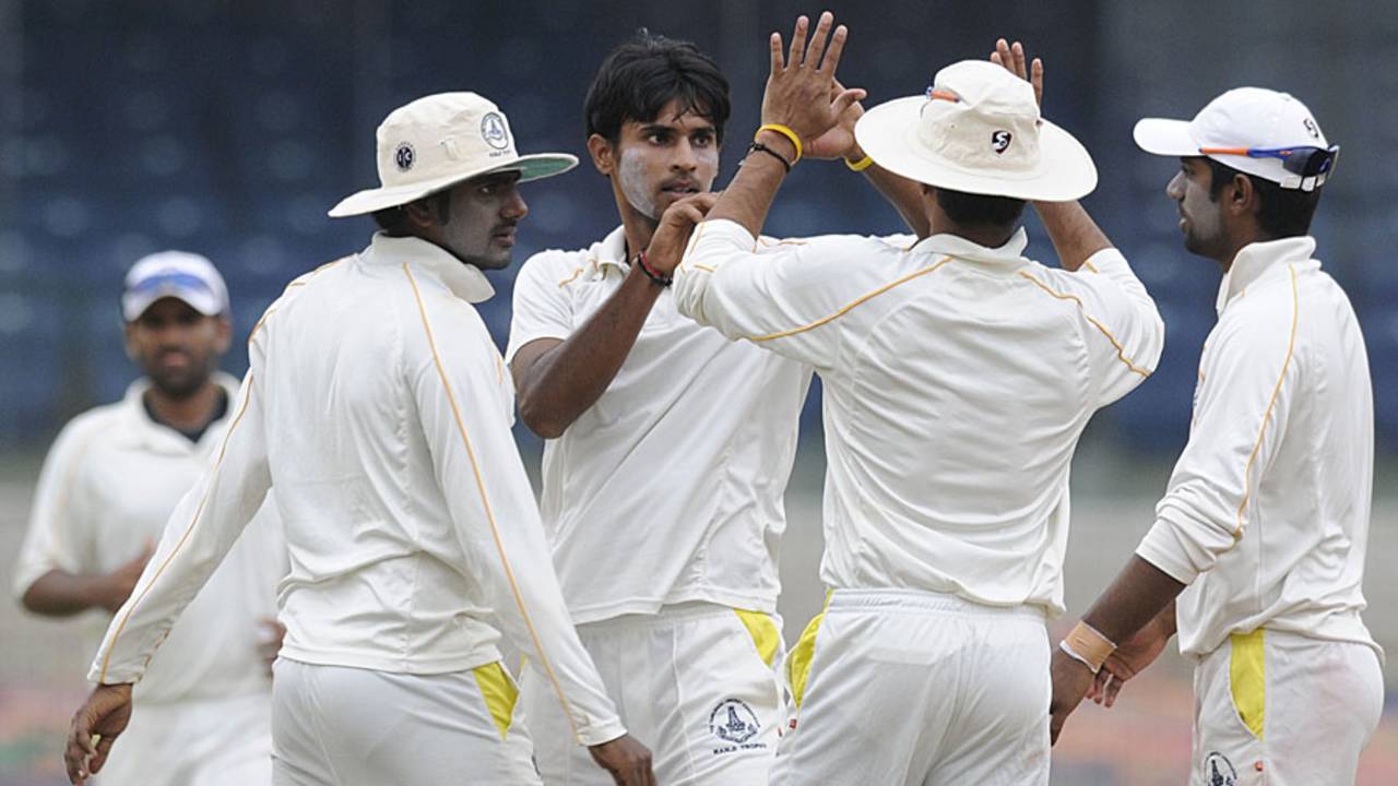 Tamil Nadu's J Kaushik celebrates a wicket