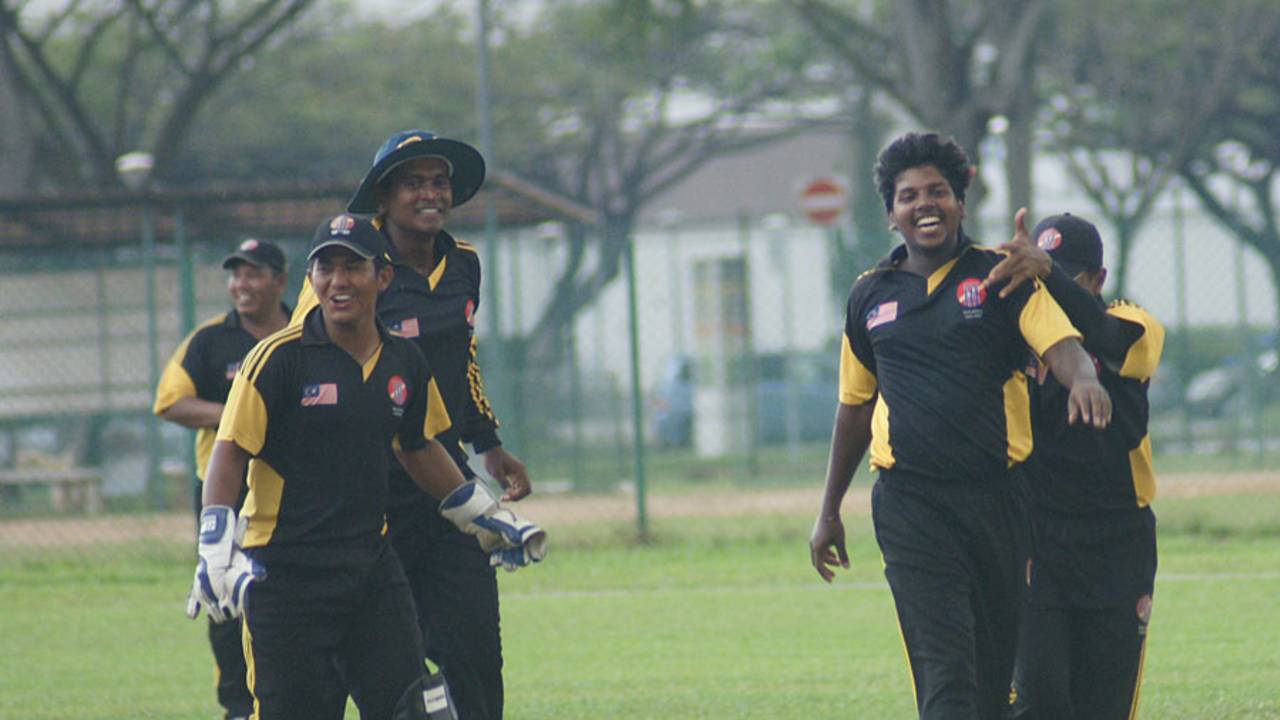 Hiran Ralalage celebrates one of his four match-winning wickets, Guernsey v Malaysia, ICC World Cricket League Division 5, Singapore, February 22, 2012