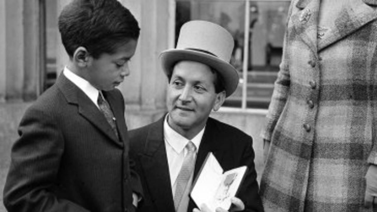 Basil D'Oliveira shows his OBE to his son Damian and wife Naomi, London, October 29, 1969