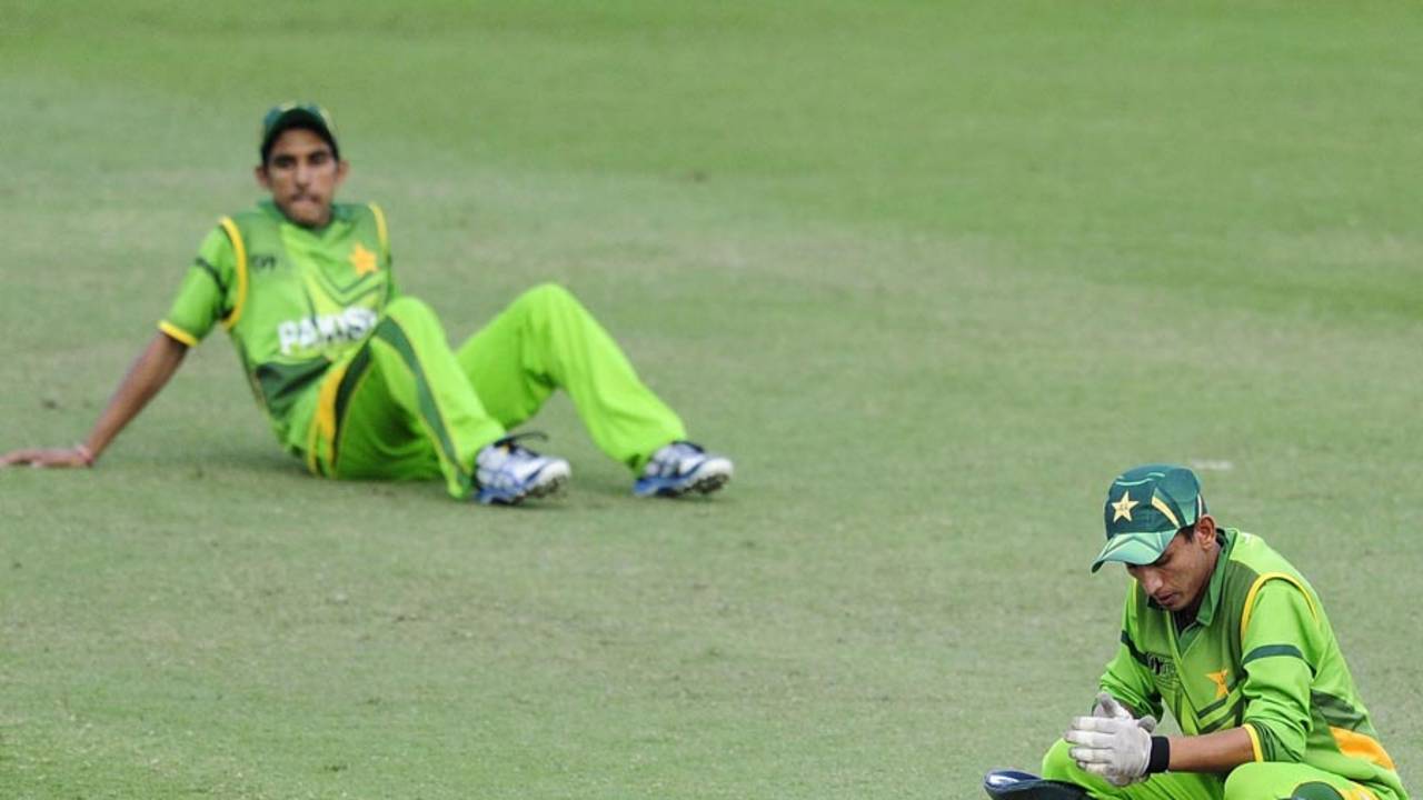 Wicketkeeper Salman Afridi is dejected after losing the quarter-final to India by one wicket