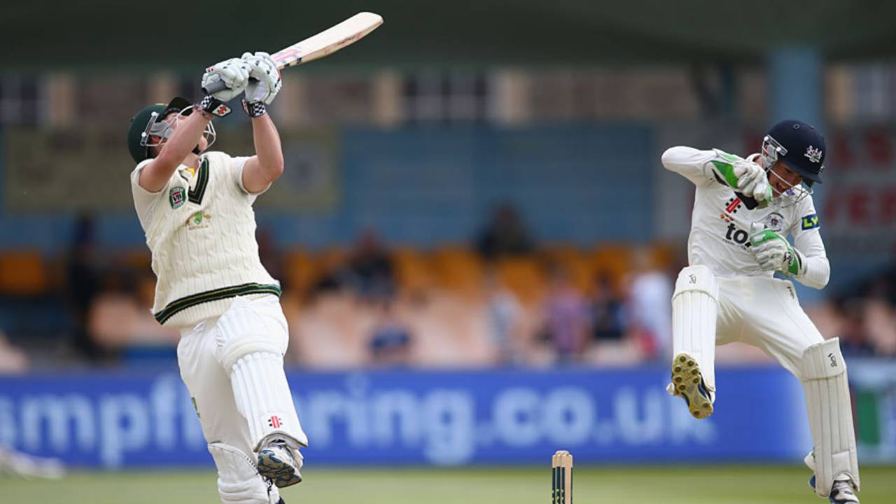 Cameron Herring takes evasive action behind the stumps while Nic Maddinson plays an upper cut, Gloucestershire v Australia A, Tour match, Bristol, 1st day, June 21, 2013
