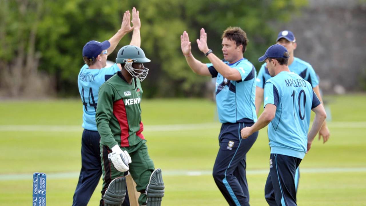 Neil Carter celebrates with team-mates after dismissing Alex Obanda, Scotland v Kenya, ICC World Cricket League Championship, Aberdeen, July 2, 2013