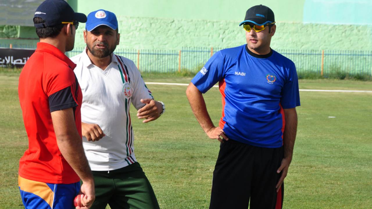 Afghanistan coach Kabir Khan advises players at a training camp, Kabul, July 23, 2013