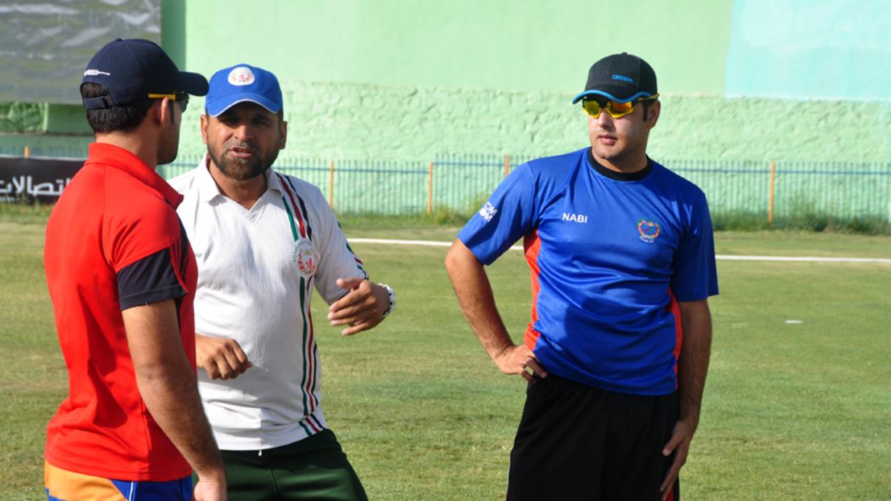 Afghanistan coach Kabir Khan advises players at a training camp, Kabul, July 23, 2013